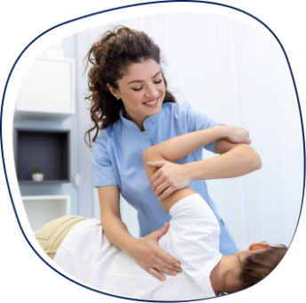 A healthcare professional in scrubs assists a patient with a physical therapy exercise, gently stretching their arm in a therapy setting. The therapist is smiling, and the environment looks bright and modern.